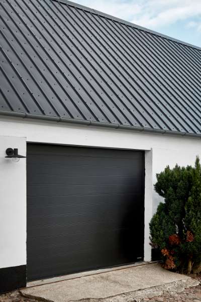 Timbre-framed farmhouse with roof made from steel profiles, Sneserevej 69, 4733 Tappernøje